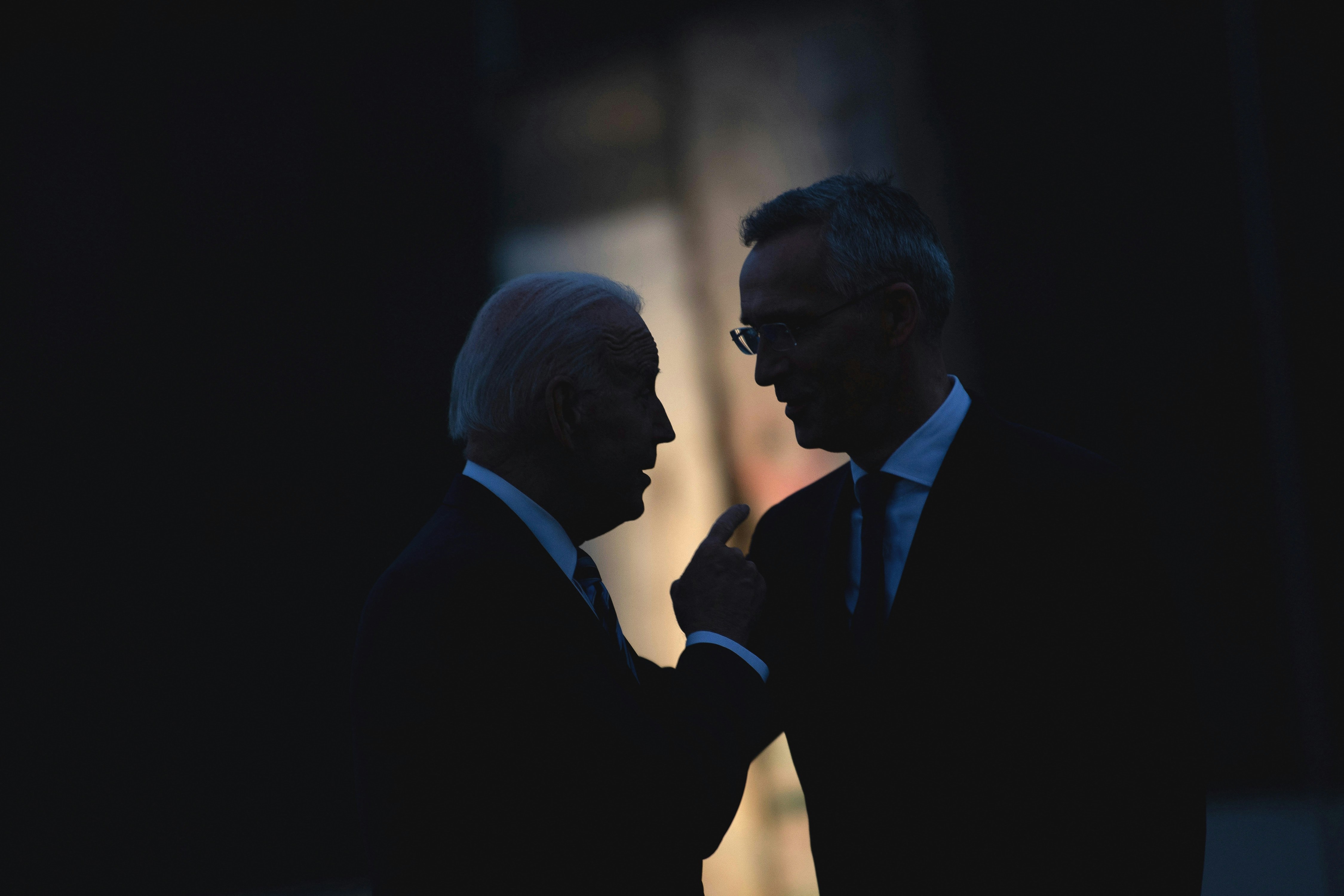 US President Joe Biden and NATO Secretary General Jens Stoltenberg (R) talk at a memorial for the September 11th terrorist attacks on the United States after a summit June 14, 2021, at NATO Headquarters in Brussels. (Photo by Brendan Smialowski / AFP) (Photo by BRENDAN SMIALOWSKI/AFP via Getty Images)