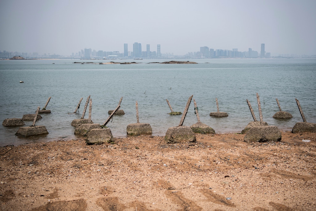 KINMEN COUNTY, TAIWAN - APRIL 20:  Aged anti-landing barricades are positioned on a beach facing China on the Taiwanese island of Little Kinmen which, at points lies only a few miles from China, on April 20, 2018 in Kinmen, Taiwan. China recently carried out live-fire military drills in the Taiwan Strait involving its Liaoning aircraft carrier, an exercise interpreted as a show of force and a message to self-governed Taiwan which China claims as its territory. The naval exercise was the first in the Taiwan Strait since 2016 and was held just over 100 miles off the coast of Taiwan. Following the defeat of the ruling Kuomintang party by the Chinese Communist Party and their retreat to Taiwan in 1949, cross-strait relations have varied from open conflict to diplomatic war. China's President, Xi Jinping, recently emphasised China's sovereignty over Taiwan by stating that 'We have sufficient abilities to thwart any form of Taiwan independence attempts'. Beijing has also imposed financial restrictions by significantly limiting the number of Chinese tour groups allowed to visit Taiwan and imposed trade sanctions on the island.  (Photo by Carl Court/Getty Images)