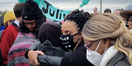 Rev. Cece Jones-Davis embraces a fellow activist on Nov. 1, 2021.
