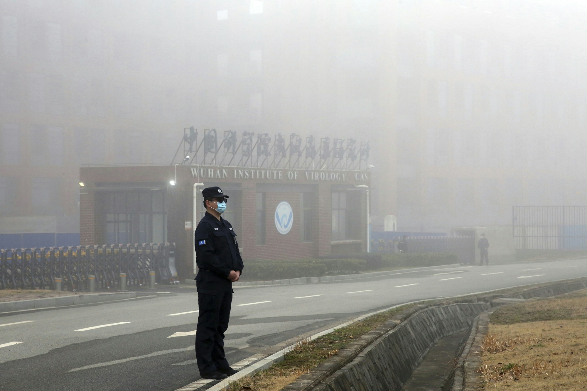 A man guards in front of Wuhan Institute of Virology in Wuhan City, Hubei Province, China on February 3, 2021. Members of World Health Organization (WHO) visited this facility on the same day. WHO probe team has been tackling to investigate into the origins of the new coronavirus COVID-19 pandemic. ( The Yomiuri Shimbun via AP Images )