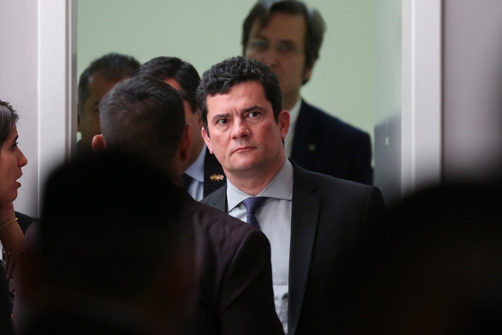 Justice Minister Sergio Moro arrives to speak to the press after the opening of the National Council of State Secretaries of Justice, Citizenship, Human Rights, and Penitentiary Administration, in Manaus, Brazil, on June 10, 2019. - Moro and prosecutors who took part in a yearslong anti-corruption probe known as "Car Wash" collaborated to convict left-wing icon Luiz Inacio Lula da Silva on corruption charges to prevent him from contesting the 2018 election, an investigative news outlet reported on June 9. Citing leaked documents, The Intercept website co-founded by Glenn Greenwald said an anonymous source had provided material, including private chats, audio recordings, videos and photos, that show "serious wrongdoing, unethical behavior, and systematic deceit." (Photo by Michael DANTAS / AFP) / The erroneous mention appearing in the byline of this photo has been modified in AFP systems in the following manner: [Michael DANTAS] instead of [Carl DE SOUZA]. Please immediately remove the erroneous mention from all your online services and delete it from your servers. If you have been authorized by AFP to distribute it to third parties, please ensure that the same actions are carried out by them. Failure to promptly comply with these instructions will entail liability on your part for any continued or post notification usage. Therefore we thank you very much for all your attention and prompt action. We are sorry for the inconvenience this notification may cause and remain at your disposal for any further information you may require.        (Photo credit should read MICHAEL DANTAS/AFP via Getty Images)