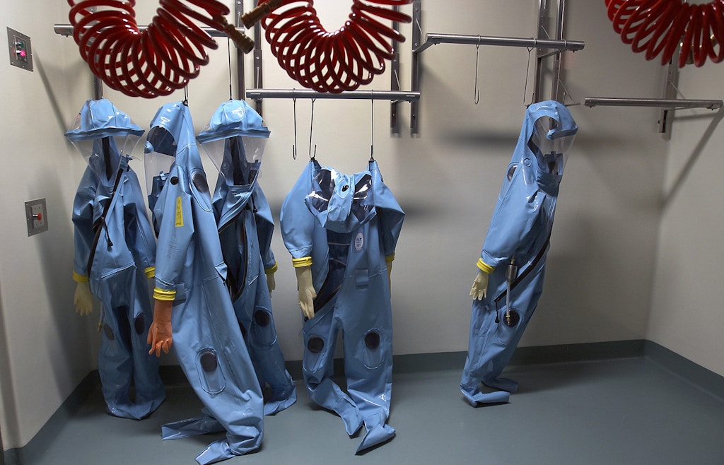 BOSTON - JANUARY 4: Protective suits hang in the lab at Boston University high security research lab in Boston. (Photo by David L Ryan/The Boston Globe via Getty Images)