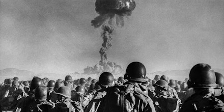 Troops from the 11th Airborne Division watch an atomic explosion at close range in the Las Vegas desert on Nov. 1, 1951.