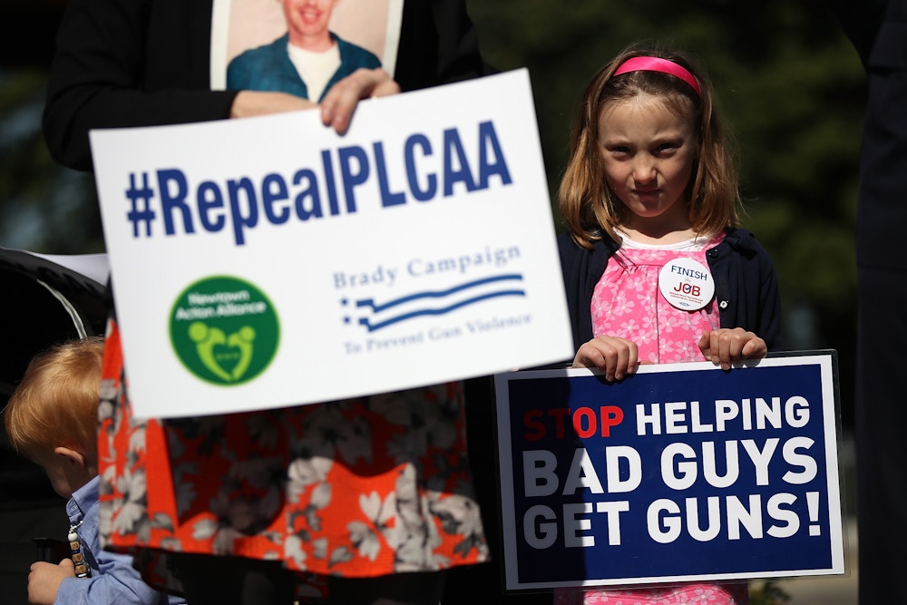 WASHINGTON, UNITED STATES - APRIL 14:  A young girl joins gun reform advocates holding a news conference outside the U.S. Capitol April 14, 2016 in Washington, DC. Members of Congress joined the activists in calling for the repeal of the Protection of Lawful Commerce in Arms Act arguing that their position would "advance sensible, popular legislation to curb the epidemic of gun violence that kills 90 Americans every day."   (Photo by Win McNamee/Getty Images)
