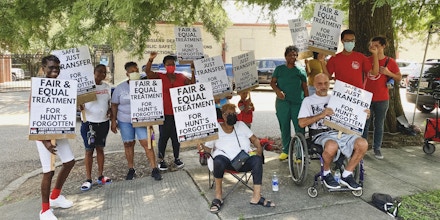 Protesters gather for a demonstration in front of Louisiana Department of Public Safety and Corrections in solidarity with people incarcerated at David Wade Correctional Center on July 23, 2021, in Baton Rouge, La.