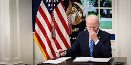 President Joe Biden listens during a video call at the Eisenhower Executive Office Building in Washington, D.C., on Dec. 27, 2021.
