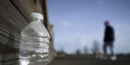 Disregarded water bottle found at Warminster community park, located at the former Naval Air Warfare Center Warminster, in Bucks County, Pennsylvania, USA  on February 6, 2019. The United States Environmental Protection Agency (EPA) is expected to release updates on tests of per- and polyfuoroalkyl substances or PFAs pollution in public water supplies for 16 million Americans in 33 states, including Pennsylvania. The federal report is delayed due to January 2019 shutdown. Reps. Brian Fitzpatrick, Republican of Bucks County in Eastern Pennsylvania and Democrat Dan Kildee, of Michigan cochair a bipartisan task force in the House of Representatives, formed to take on the growingPFAS ContaminationCrisis. The usage of foam at nearby former military bases is linked to tainted drinking water, affecting tens of thousands of residents in Bucks and Montgomery Counties in Eastern Pennsylvania. (Photo by Bastiaan Slabbers/NurPhoto via Getty Images)