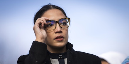 Rep. Alexandria Ocasio-Cortez, D.-N.Y., prepares to speak during a rally outside the Capitol in Washington, D.C., on Dec. 7, 2021.