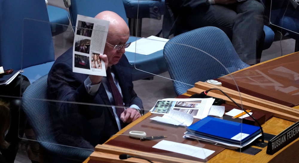 Russia Ambassador to the UN Vassily Nebenzia shows documents during a UN Security Council emergency meeting, in New York on March 11, 2022. - The Security Council is holding the meeting on alleged manufacture of biological weapons in Ukraine at the request of Moscow. Russia on March 10, 2022, accused the US of funding research into the development of biological weapons in Ukraine, which has faced an assault by tens of thousands of Russian troops since February 24, 2022. (Photo by TIMOTHY A. CLARY / AFP) (Photo by TIMOTHY A. CLARY/AFP via Getty Images)