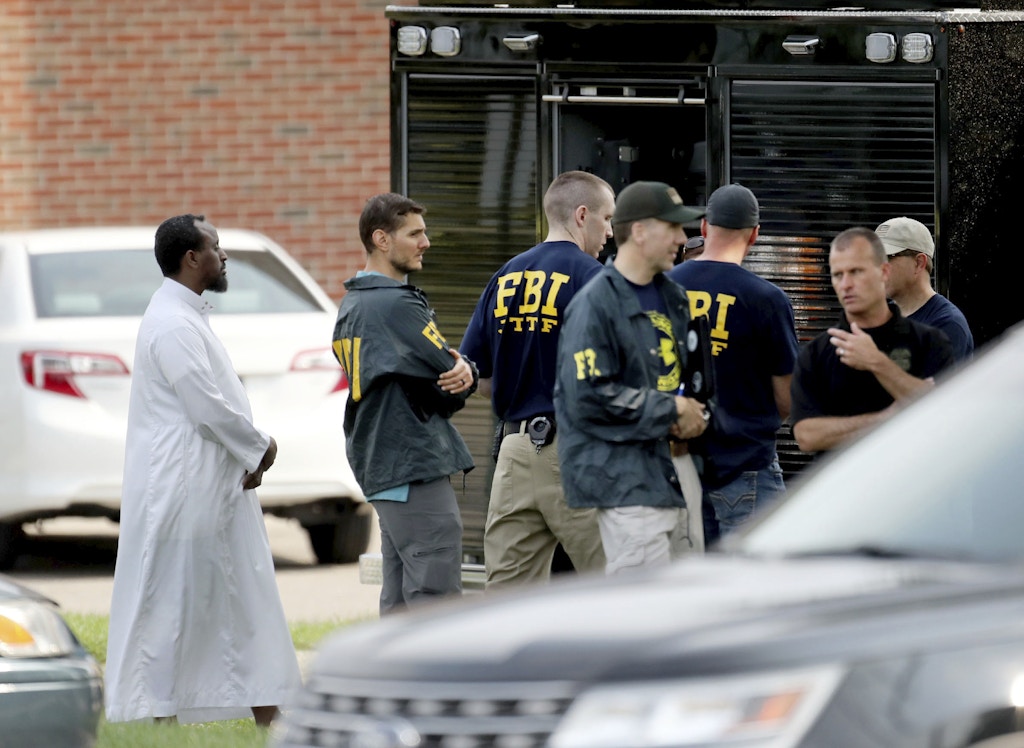FILE - In this Aug. 15, 2017, file photo, law enforcement officials investigate the site of an explosion at the Dar Al-Farooq Islamic Center in Bloomington, Minn. Michael Hari, 49, of Clarence, Illinois, is the only one of three men accused in the attack to go to trial. Two Illinois men who pleaded guilty to a 2017 bombing of a Minnesota mosque testified that the group's alleged ringleader, Michael Hari, recruited them for an unspecified job and didn't fill them in on his plan until they neared their target. (David Joles/Star Tribune via AP, File)