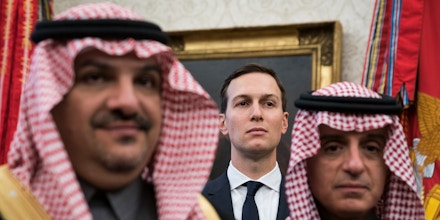 White House senior adviser Jared Kushner stands among Saudi officials as former President Donald Trump talks with Crown Prince Mohammad bin Salman of the Kingdom of Saudi Arabia at the White House, March 20, 2018 in Wash