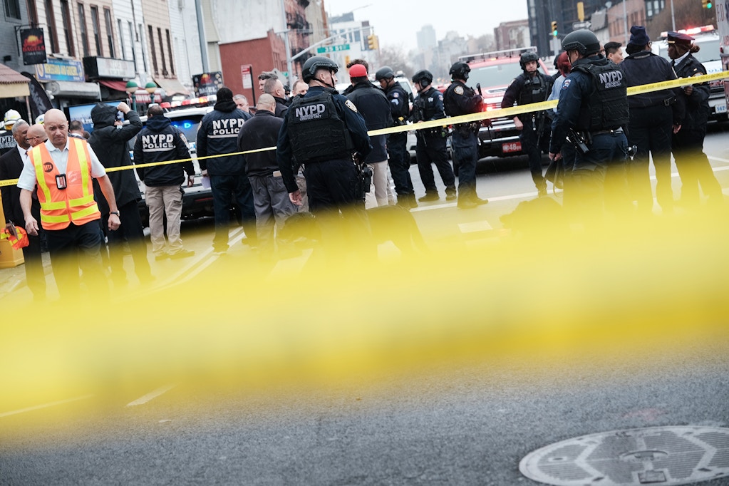 NEW YORK, NEW YORK - APRIL 12: Police and emergency responders gather at the site of a reported shooting of multiple people outside of the 36 St subway station on April 12, 2022 in the Brooklyn borough of New York City. According to authorities, multiple people have reportedly been shot and several undetonated devices were discovered at the 36th Street and Fourth Avenue station in the Sunset Park neighborhood. (Photo by Spencer Platt/Getty Images)