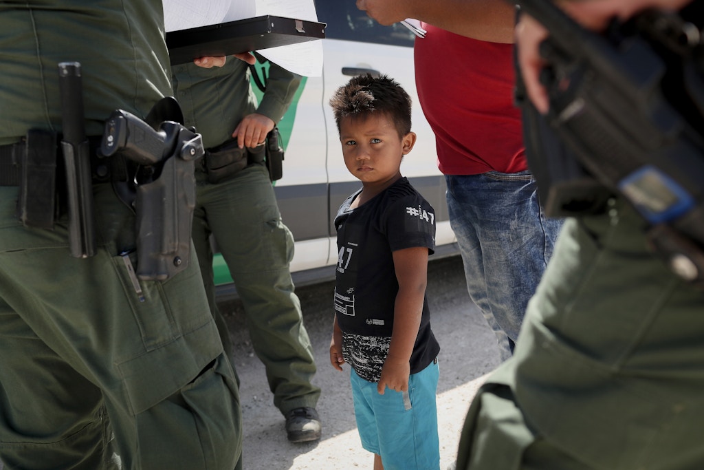MISSION, TX - JUNE 12:  U.S. Border Patrol agents take into custody a father and son from Honduras near the U.S.-Mexico border on June 12, 2018 near Mission, Texas. The asylum seekers were then sent to a U.S. Customs and Border Protection (CBP) processing center for possible separation. U.S. border authorities are executing the Trump administration's zero tolerance policy towards undocumented immigrants. U.S. Attorney General Jeff Sessions also said that domestic and gang violence in immigrants' country of origin would no longer qualify them for political-asylum status.  (Photo by John Moore/Getty Images)