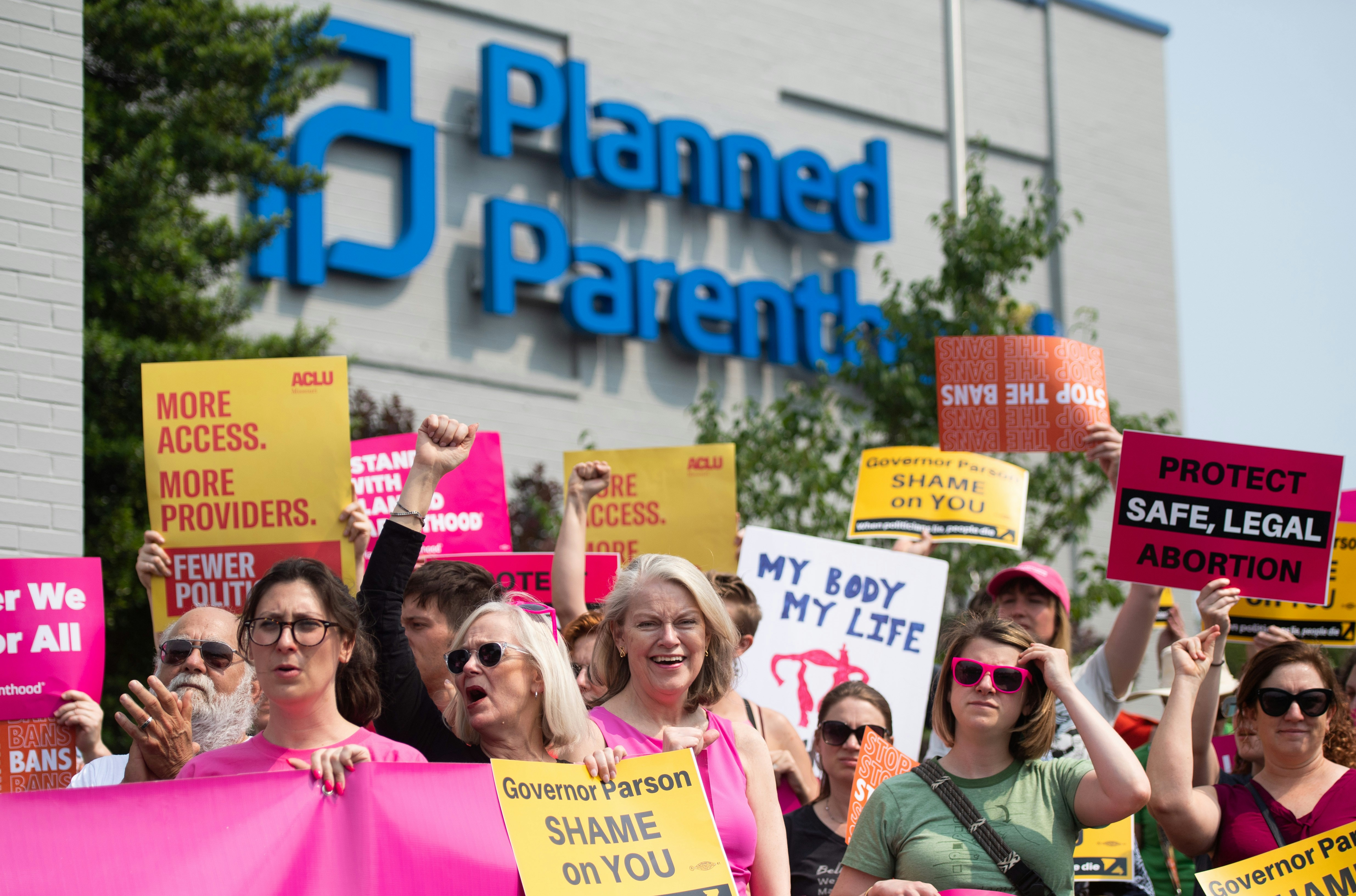 Pro-choice supporters and staff of Planned Parenthood hold a rally outside the Planned Parenthood Reproductive Health Services Center in St. Louis, Missouri, May 31, 2019, the last location in the state performing abortions. - A US Court on May 31, 2019 blocked Missouri from closing the clinic. (Photo by SAUL LOEB / AFP)        (Photo credit should read SAUL LOEB/AFP via Getty Images)