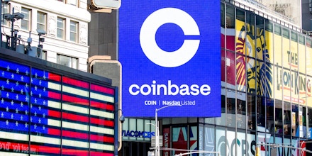 Monitors display Coinbase signage during the company's initial public offering (IPO) at the Nasdaq MarketSite in New York, U.S., on Wednesday, April 14, 2021. Coinbase Global Inc., the largest U.S. cryptocurrency exchange, is set to debut on Wednesday through a direct listing, an alternative to a traditional initial public offering that has only been deployed a handful of times. Photographer: Michael Nagle/Bloomberg via Getty Images