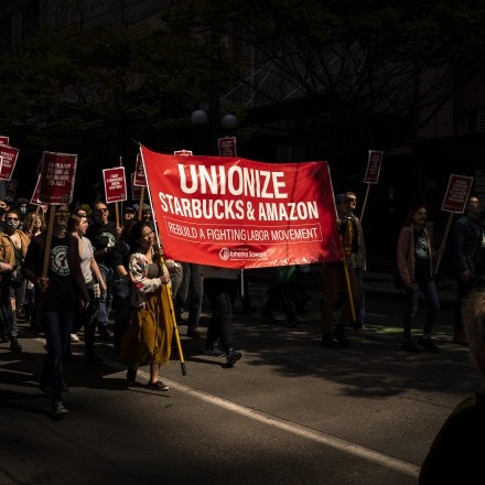 Demonstrators during the 'Fight Starbucks Union Busting' rally in Seattle, Washington, U.S., on Saturday, April 23, 2022. Starbucks filed two complaints with the U.S. National Labor Relations Board alleging unfair practices by labor organizers toward workers and what it calls 