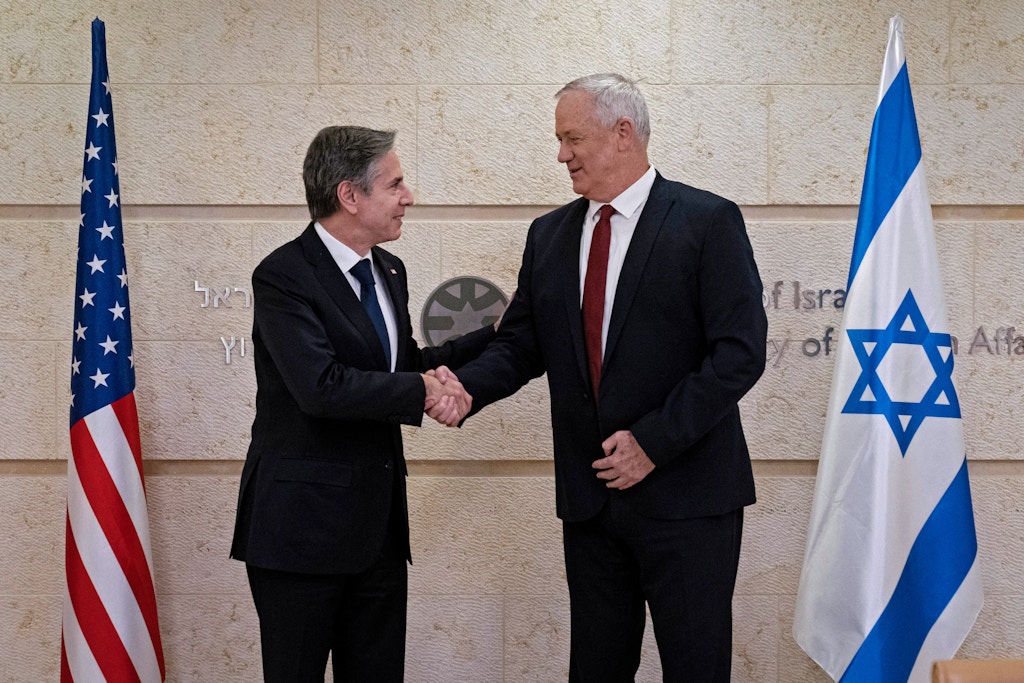 US Secretary of State Antony Blinken (L) shakes hands with Israeli Defense Minister Benny Gantz at the Ministry of Foreign Affairs in Jerusalem on May 25, 2021. - The US top diplomat, on a regional tour this week in the Middle East, vowed support to help rebuild the battered Gaza Strip and shore up a truce between Hamas and Israel, but insisted the territory's Islamist militant rulers would not benefit from any aid. (Photo by Alex Brandon / POOL / AFP) (Photo by ALEX BRANDON/POOL/AFP via Getty Images)