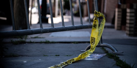 Police tape hangs from a barricade at the corner of Lombard and 4th Streets in Philadelphia, Pennsylvania, on June 5, 2022, the day after gunfire left three people dead and 11 others wounded. - Three people were killed and 11 others wounded late on June 4, 2022, in the US city of Philadelphia after multiple shooters opened fire into a crowd on a busy street, police said. (Photo by Kriston Jae Bethel / AFP) (Photo by KRISTON JAE BETHEL/AFP via Getty Images)