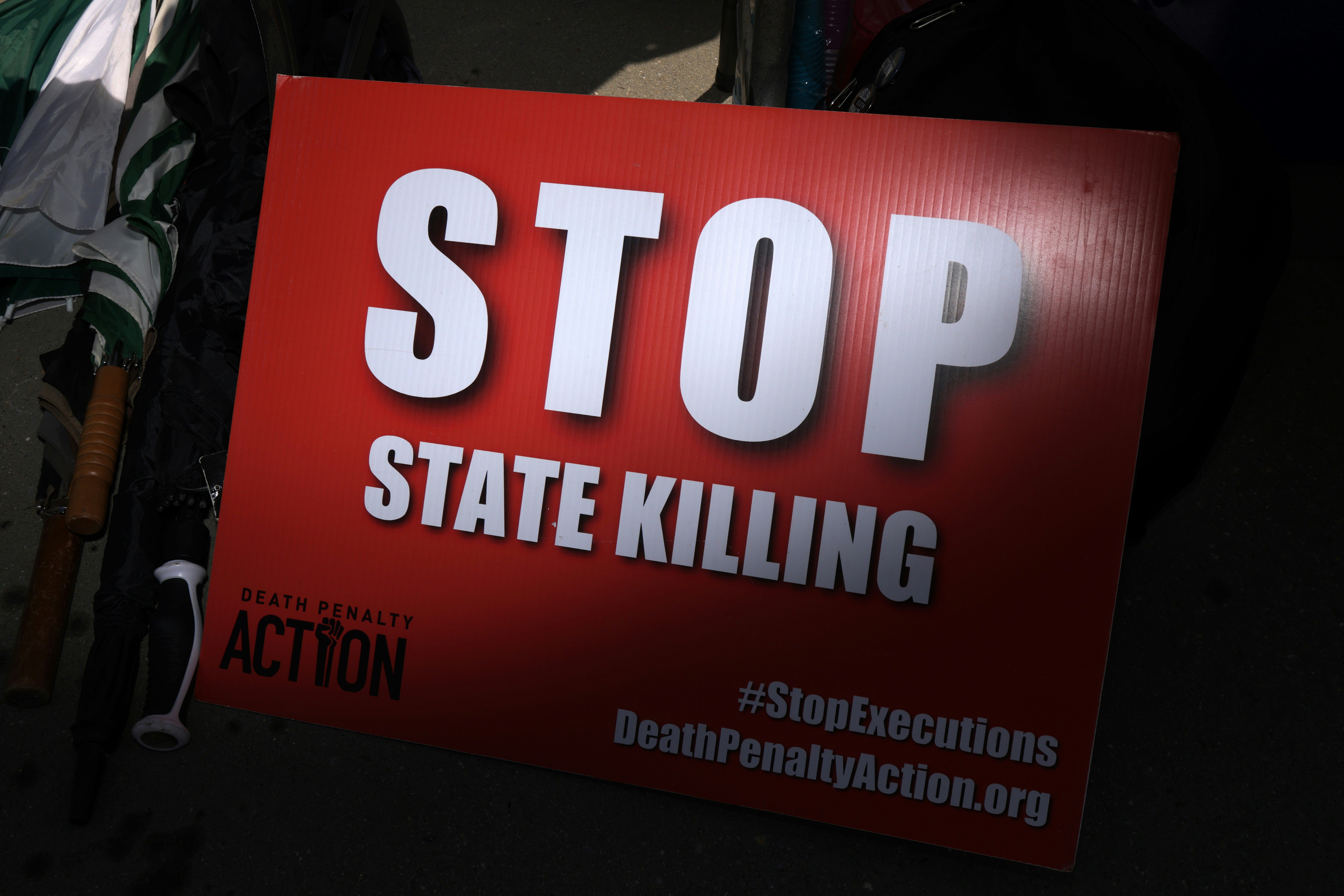 WASHINGTON, DC - on June 29:  A sign that reads "Stop State Killing" is seen during a vigil against the death penalty in front of the U.S. Supreme Court on June 29, 2021 in Washington, DC. The Death Penalty Action and The Abolitionist Action Committee are hosting daily vigils through July 2 to mark the anniversaries of "the historic 1972 Furman and 1976 Gregg Supreme Court decisions on the death penalty." (Photo by Alex Wong/Getty Images)