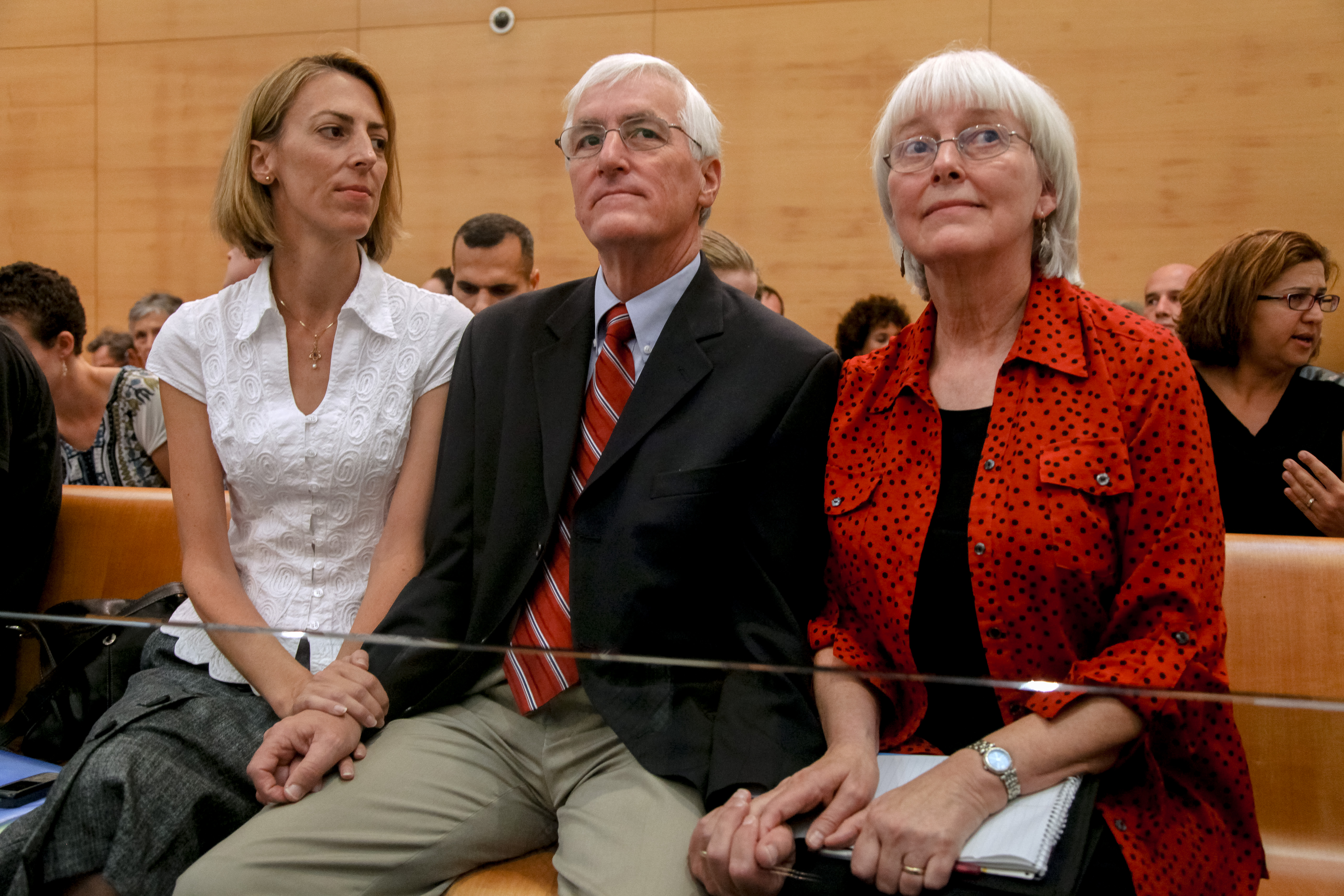 HAIFA, ISRAEL - 28 AUGUST:  (L-R) Sister Sarah Corrie, father Craig Corrie and mother Cindy Corrie of US peace activist Rachel Corrie sit in the Haifa District Court on August 28, 2012 in Haifa, Israel. 23-year-old Rachel Corrie was run over by an Israeli army bulldozer in Gaza in 2003. Judge Oded Gershon and the Israeli court have reached a verdict today statting that Israel is not to blame for her death and that it was a ''regrettable accident''.  (Photo by Avishag Shaar-Yashuv/Getty Images)