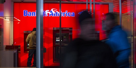 A customer uses an automated teller machine (ATM) inside of the Bank of America Corp. Financial Center in New York, U.S., on Friday, Jan. 12, 2016. Bank of America is scheduled to report earnings data on January 19. Photographer: John Taggart/Bloomberg via Getty Images