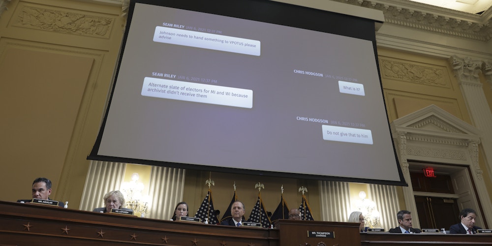 WASHINGTON, DC - JUNE 21: A text exchange between a staffer for Sen. Ron Johnson and an aide to former U.S. Vice President Mike Pence appears on a video screen during the fourth hearing on the January 6th investigation in the Cannon House Office Building on June 21, 2022 in Washington, DC. The bipartisan committee, which has been gathering evidence for almost a year related to the January 6 attack at the U.S. Capitol, is presenting its findings in a series of televised hearings. On January 6, 2021, supporters of former President Donald Trump attacked the U.S. Capitol Building during an attempt to disrupt a congressional vote to confirm the electoral college win for President Joe Biden. (Photo by Kevin Dietsch/Getty Images)