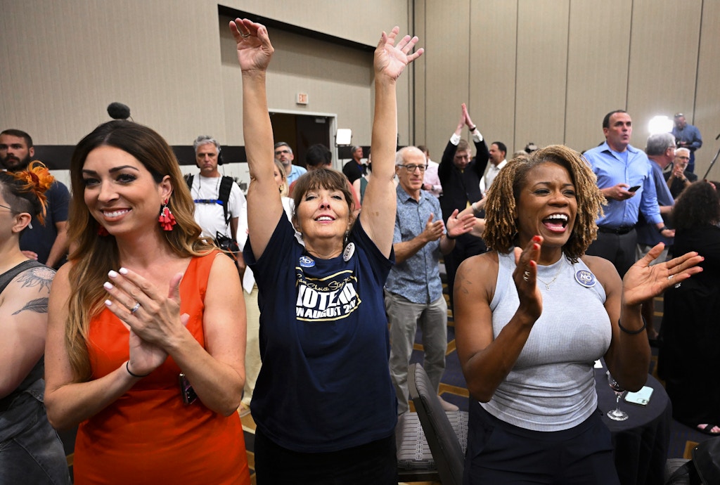 Calley Malloy, left, of Shawnee, Kan.; Cassie Woolworth, of Olathe, Kan.; and Dawn Rattan, right, of Shawnee, Kan., applaud during a primary watch party Tuesday, Aug. 2, 2022, in Overland Park, Kan. Kansas voters rejected a ballot measure in a conservative state with deep ties to the anti-abortion movement that would have allowed the Republican-controlled Legislature to tighten restrictions or ban abortion outright.(Tammy Ljungblad AP)/The Kansas City Star via AP)