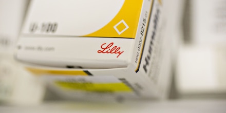 An Eli Lilly & Co. logo is seen on a box of Humulin brand insulin medication in this arranged photograph at a pharmacy in Princeton, Illinois, U.S., on Monday, Oct. 23, 2017. Eli Lilly is scheduled to release earnings figures on October 24. Photographer: Daniel Acker/Bloomberg via Getty Images