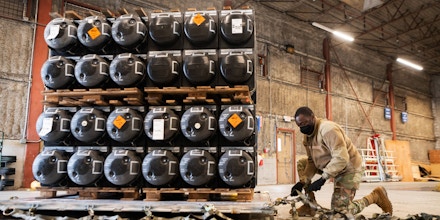 Palletizes ammunition, weapons and other equipment bound for Ukraine at Dover Air Force Base, Delaware, Jan. 21, 2022.