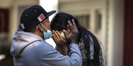 Edgartown MA - September 15th 2022: Rafael Eduardo (left) an undocumented immigrant from Venezuela hugs another immigrant outside of the Saint Andrews Episcopal Church, on Marthas Vineyard. Photo by Dominic Chavez(Photo by Dominic Chavez for The Washington Post via Getty Images)