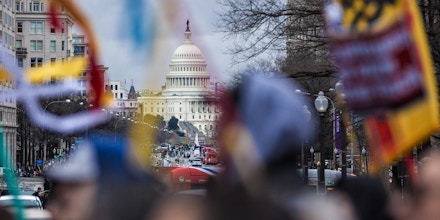 Demonstrators walks past the U.S. Capitol during a protest against the Dakota Access Pipeline (DAPL) in Washington, D.C., U.S., on Friday, March 10, 2017. The Standing Rock Sioux Tribe and Indigenous grassroots leaders arranged for the march to protect native sovereignty, keep fossil fuels in the ground and stop construction of the DAPL project. Photographer: Andrew Harrer/Bloomberg via Getty Images