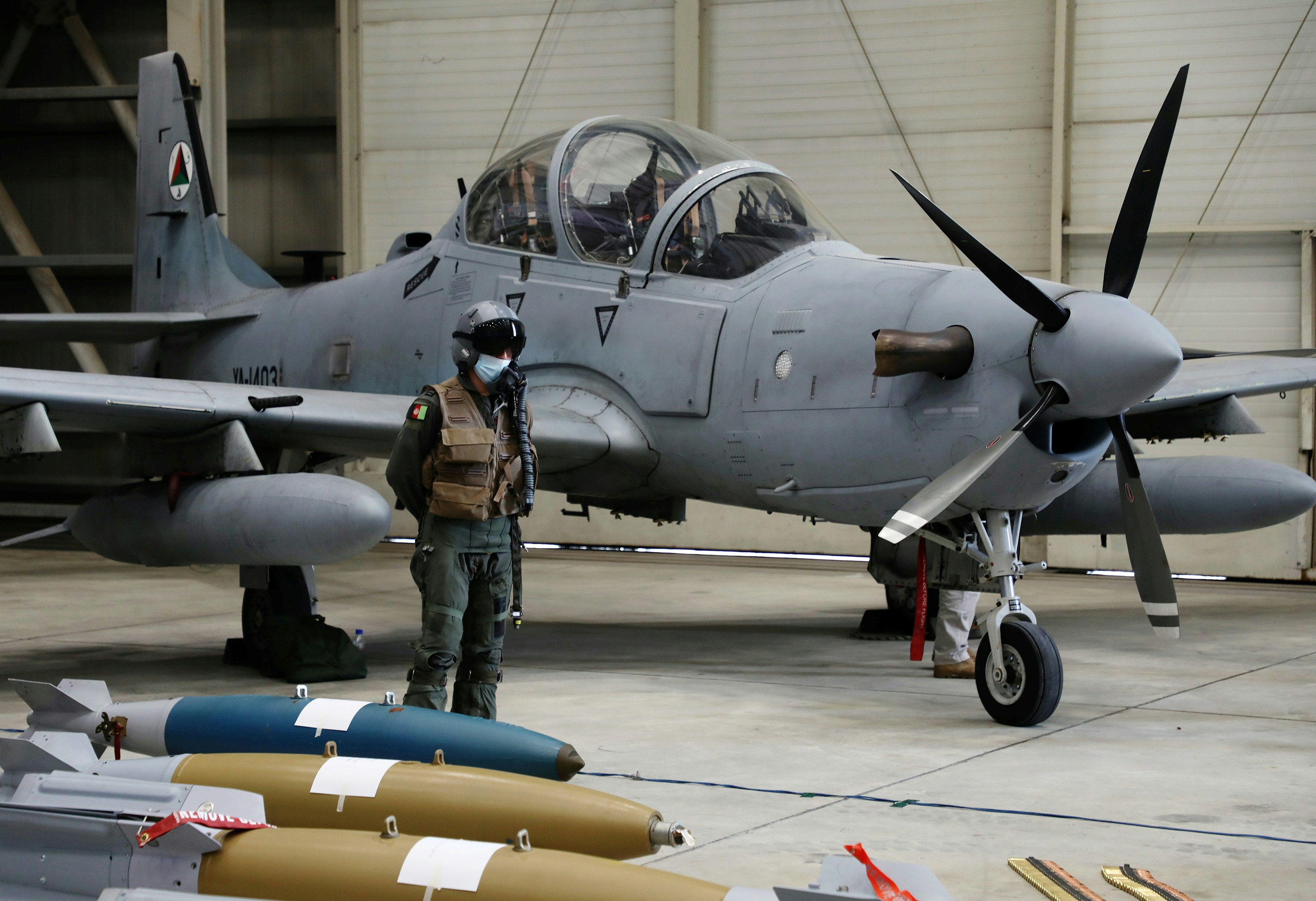 An Afghan pilot stands next to A-29 Super Tucano plane during a handover ceremony of A-29 Super Tucano planes from U.S. to the Afghan forces, in Kabul, Afghanistan September 17, 2020. REUTERS/Omar Sobhani - RC290J9DAOTC