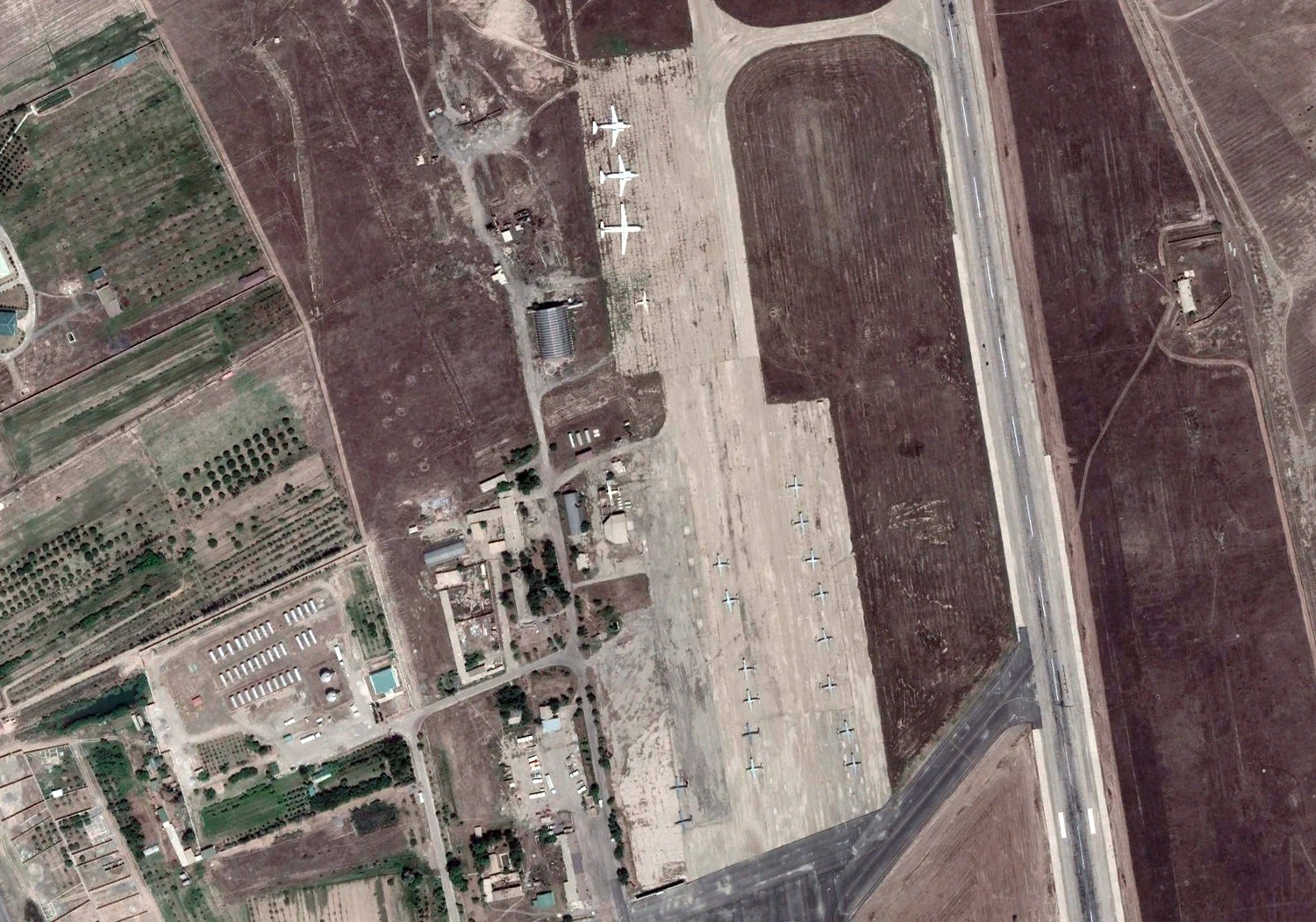 A satellite image of Bokhtar International Airport in Tajikistan in May 2022 shows at least 16 fixed-wing aircraft on the tarmac. These aircraft appeared at Bokhtar after mid-August 2021, according to images analyzed by The Intercept, and match the description of Afghan Air Force planes flown there by Ahmadi and other pilots after the Taliban took Kabul.