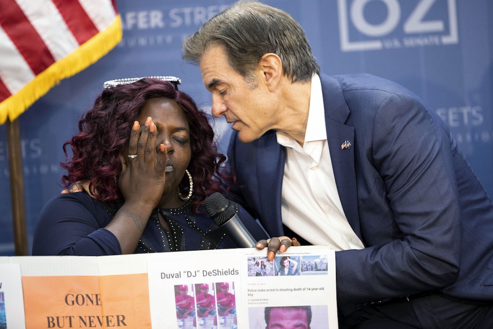 FILE—Mehmet Oz, a Republican candidate for U.S. Senate in Pennsylvania, speaks speaks with Sheila Armstrong, 45, who lost her brother to gun violence at House of Glory Philly CDC in Philadelphia, in this file photo from Sept. 19, 2022. Black voters are at the center of an increasingly competitive battle in a race that could tilt control of the Senate between Oz and Democrat John Fetterman, as Democrats try to harness outrage over the Supreme Court's abortion decision and Republicans tap the national playbook to focus on rising crime in cities. (AP Photo/Ryan Collerd, File)