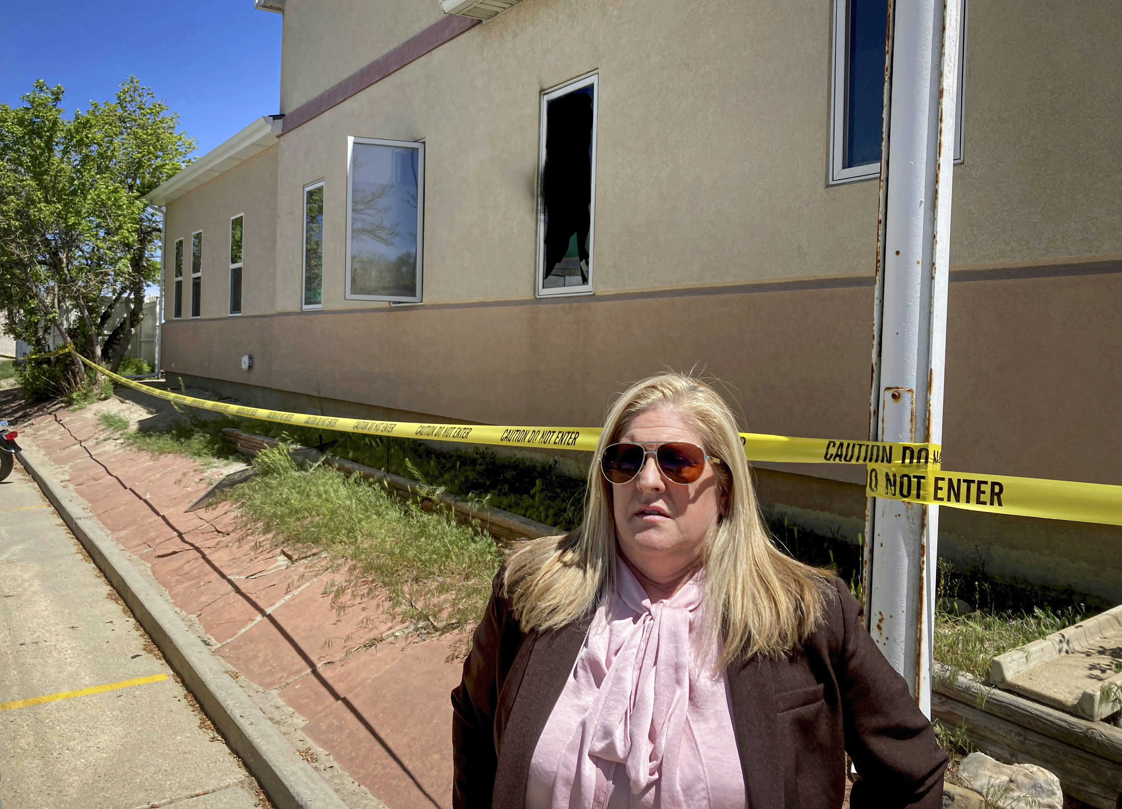Julie Burkhart, founder of the Wellspring Health Access clinic in Casper, Wyo., stands outside the clinic on Thursday, May 26, 2022. The women's health and abortion clinic, which would be the only one of its kind in the state, was set to open in mid-June but an arson fire has delayed the opening by at least several weeks. (AP Photo/Mead Gruver)