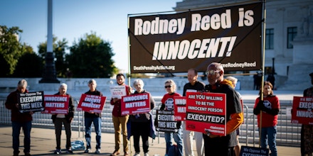 A demonstrator holding a placard speaks to protest against the death penalty in the Rodney Reed v. Bryan Goertz case in front of the Supreme Court Building. (Photo by Jordan Tovin / SOPA Images/Sipa USA)(Sipa via AP Images)