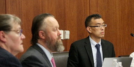 Wayne Hsiung, right, and Paul Picklesimer, center, on trial in Utah's Fifth District Court.