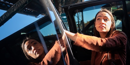NEW YORK, NY - NOVEMBER 08: Representative Alexandria Ocasio-Cortez (D-NY) departs in a SUV after campaigning with Gov. Kathy Hochul (D-NY) on November 8, 2022 in New York City. Hochul holds a slim lead in the polls against Republican candidate Rep. Lee Zeldin. (Photo by David Dee Delgado/Getty Images)