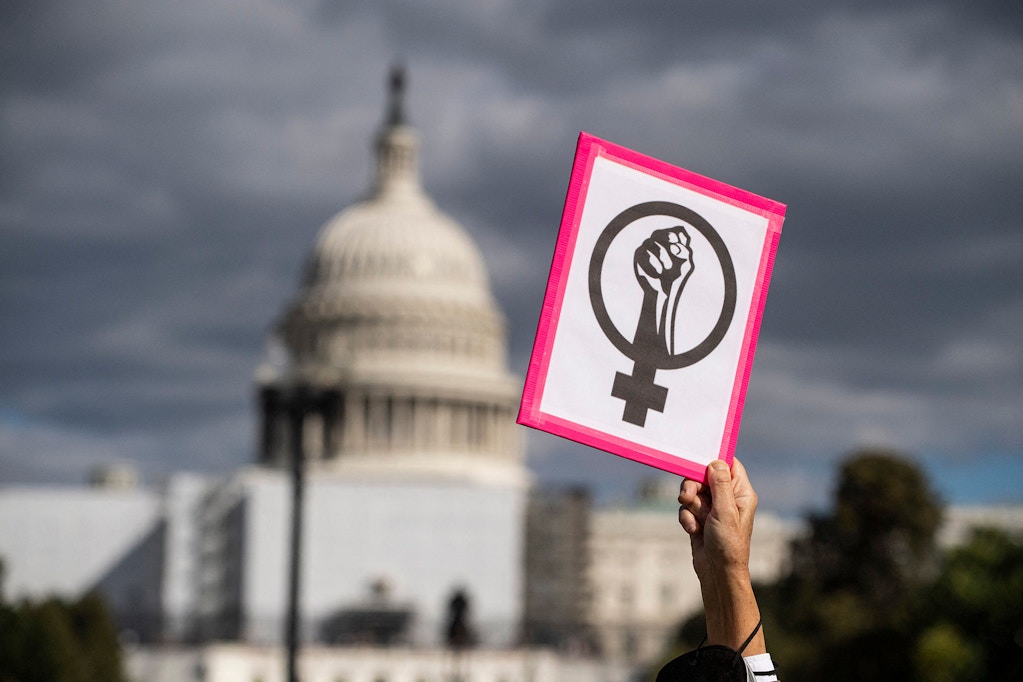 An abortion rights demonstrator holds a sign near the US Capitol during the annual Women's March , Washington, D.C., Oct. 8, 2022.