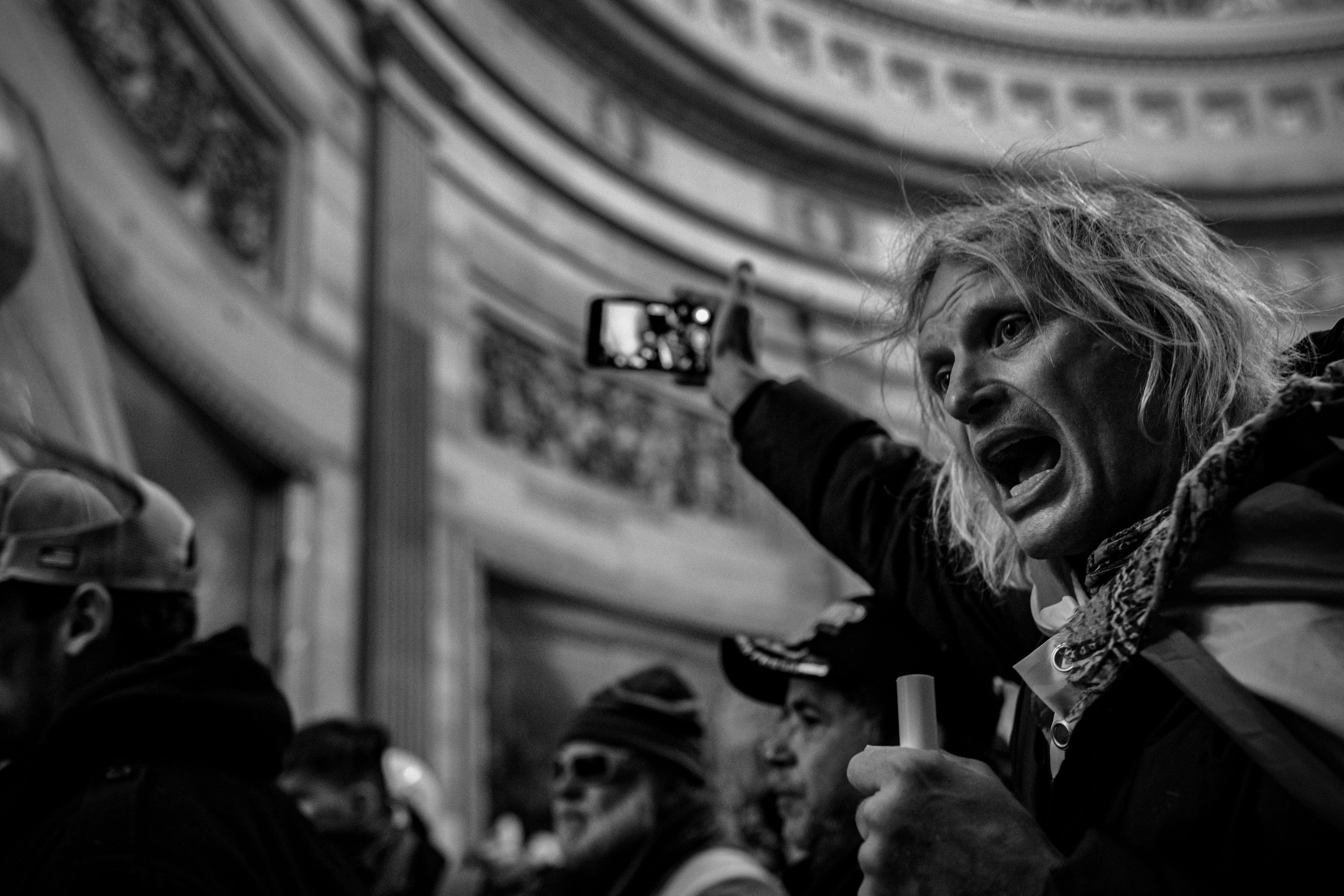 Protesters storm the Rotunda, inside the Capitol in Washington, D.C. after listening to a speech by President Trump on January 6, 2021. A large mob who convened on Washington, D.C. for a ?Save America? or ?Stop the Steal? rally was incited by President Trump and stormed the United States Capitol building, fighting with police, and damaging offices and rooms as they made their way through the building.As President Trump openly condoned the violence, the D.C, mayor called for a 6 p.m. curfew, and mobilized the National Guard. (Photo by Ashley Gilbertson / VII Photo)