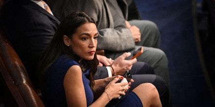 US Representative Alexandria Ocasio-Cortez, Democrat of New York, watches as the US House of Representatives convenes for the 118th Congress and conducts a second vote for Speaker of the House, at the US Capitol in Washington, DC, January 3, 2023. - Divided Republicans in the US House of Representatives failed to elect a speaker in the opening round of voting for the first time in 100 years Tuesday as right-wing rebels blocked McCarthy, the party favorite. (Photo by Mandel NGAN / AFP) (Photo by MANDEL NGAN/AFP via Getty Images)