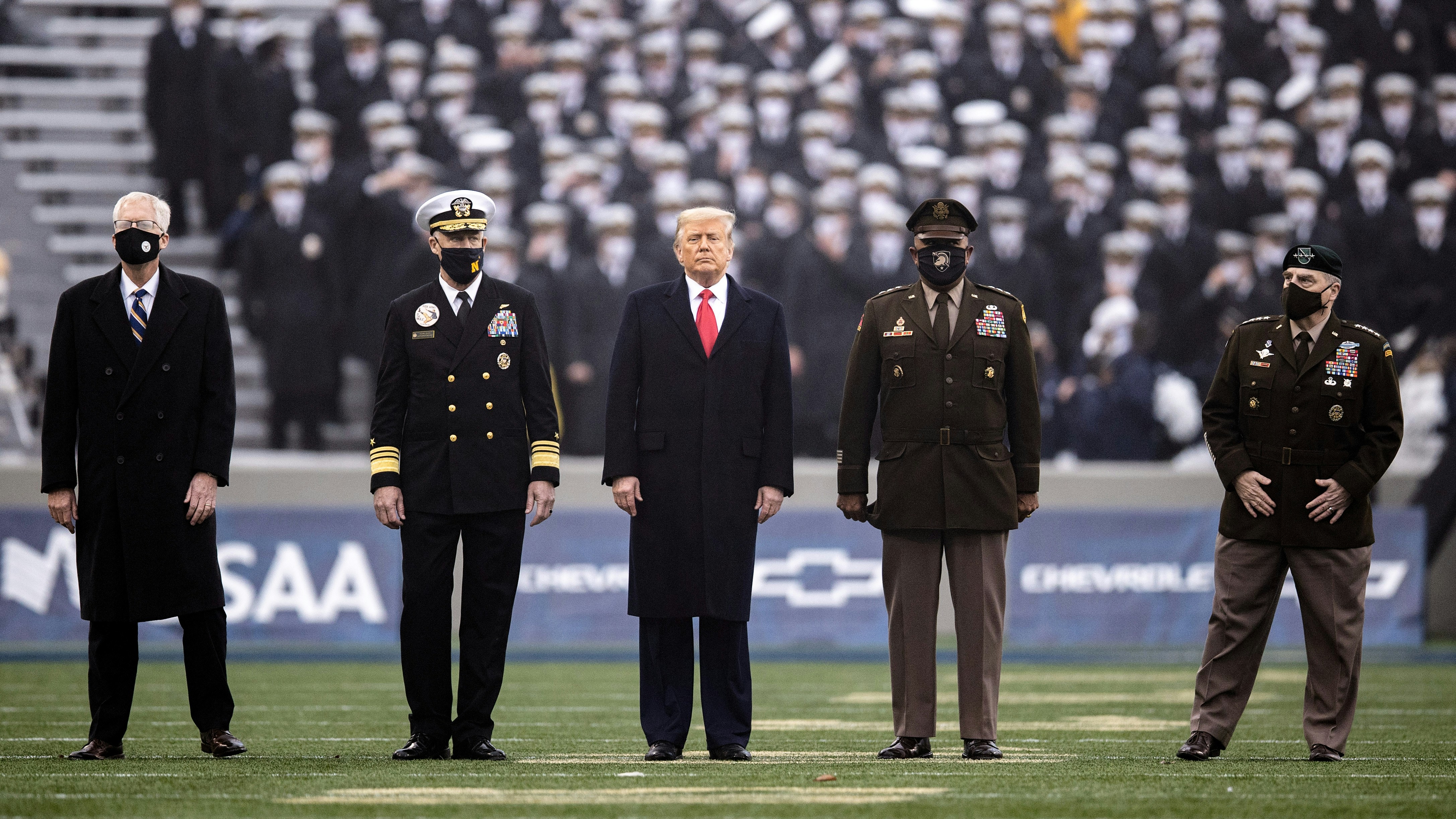 WEST POINT, NY - DECEMBER 12: Acting Secretary of Defense, Christopher C. Miller, United States Naval Academy Superintendent Vice Admiral Sean Buck, President Donald Trump, Superintendent of the United States Military Academy Lieutenant General Darryl A. Williams, and Chairman of the Joint Chiefs Mark A. Milley before the start of a game between the Army Black Knights and the Navy Midshipmen at Michie Stadium on December 12, 2020 in West Point, New York. (Photo by Dustin Satloff/Getty Images)