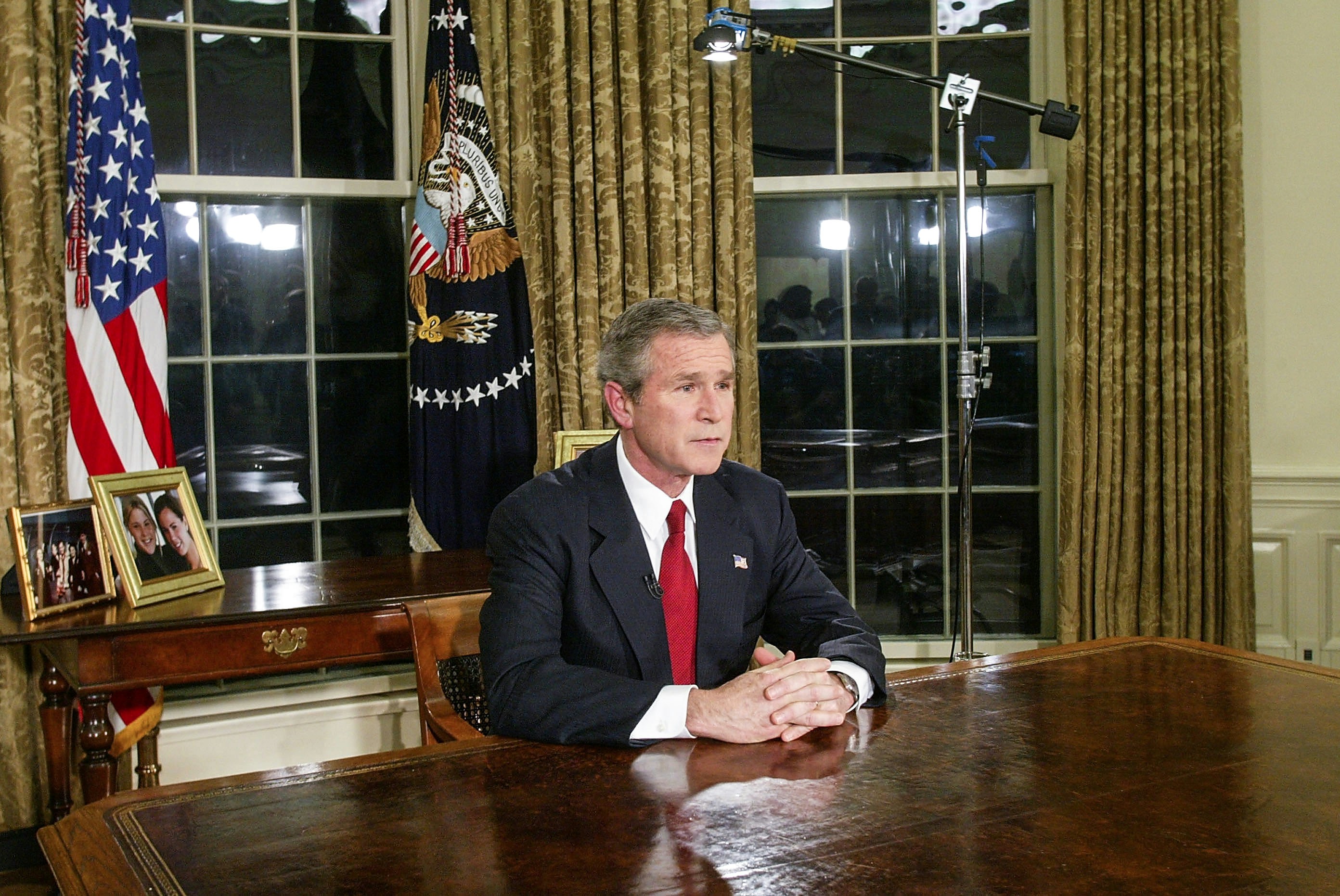 WASHINGTON - MARCH 19:  U.S. President George W. Bush  addresses the nation March 19, 2003 in the Oval Office of the White House in Washington, DC. Bush announced that the U.S. military struck at "targets of opportunity" in Iraq March 19, 2003 in Washington, DC. Air defense sirens and anti-aircraft fire was reported briefly in Baghdad.  (Photo by Alex Wong/Getty Images)