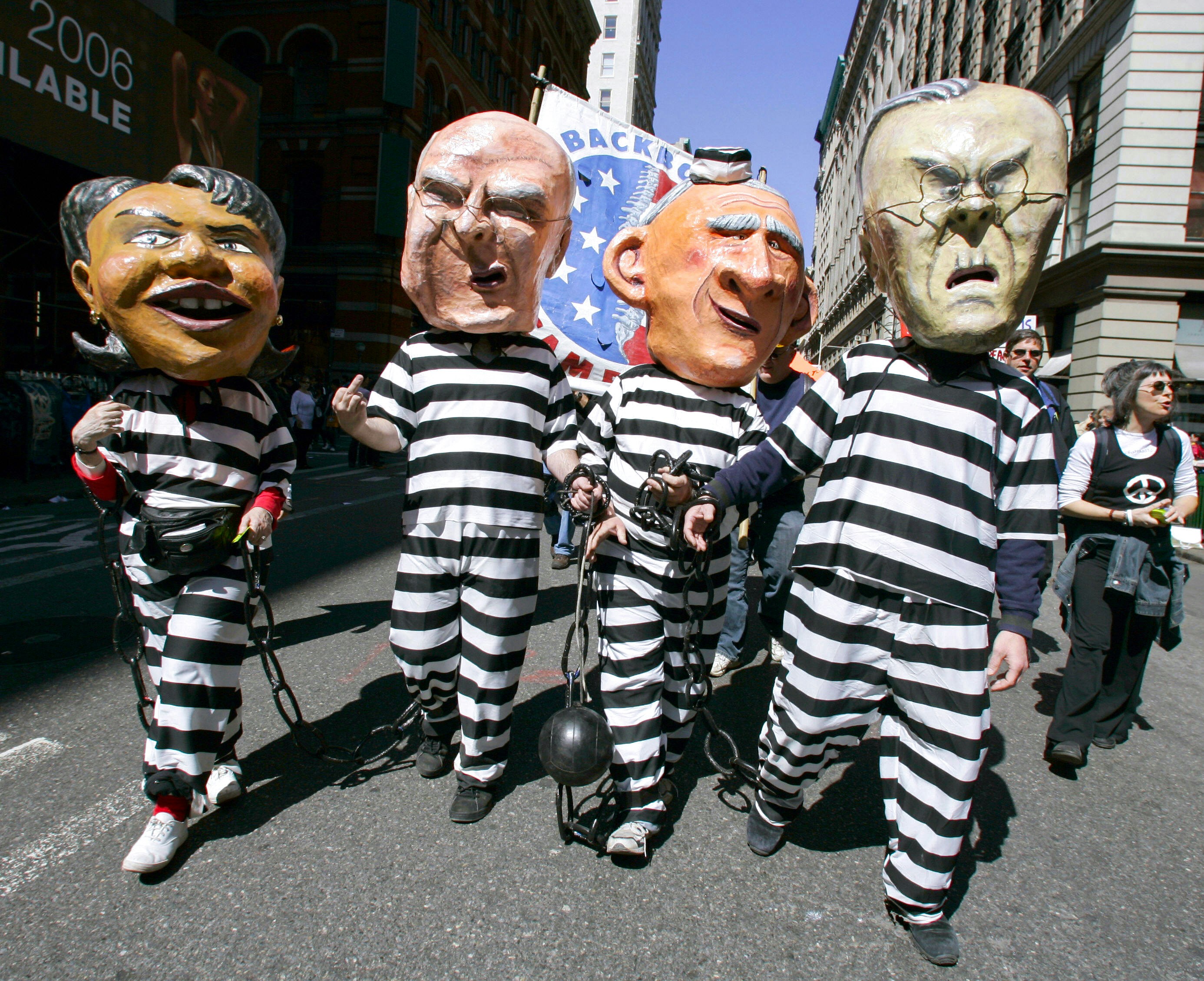 New York, UNITED STATES:  Anti-war protestors dressed as US Secretary of State Condoleezza Rice, Vice President Dick Cheney, President George W. Bush and Defense Secretary Donald Rumsfeld in prison garb march down Broadway on their way to lower Manhattan 29 April 2006 during the March for Peace, Justice and Democracy. The march was just one of the many protests all over the country calling for an end to the war in Iraq.      AFP PHOTO/Timothy A. CLARY  (Photo credit should read TIMOTHY A. CLARY/AFP via Getty Images)