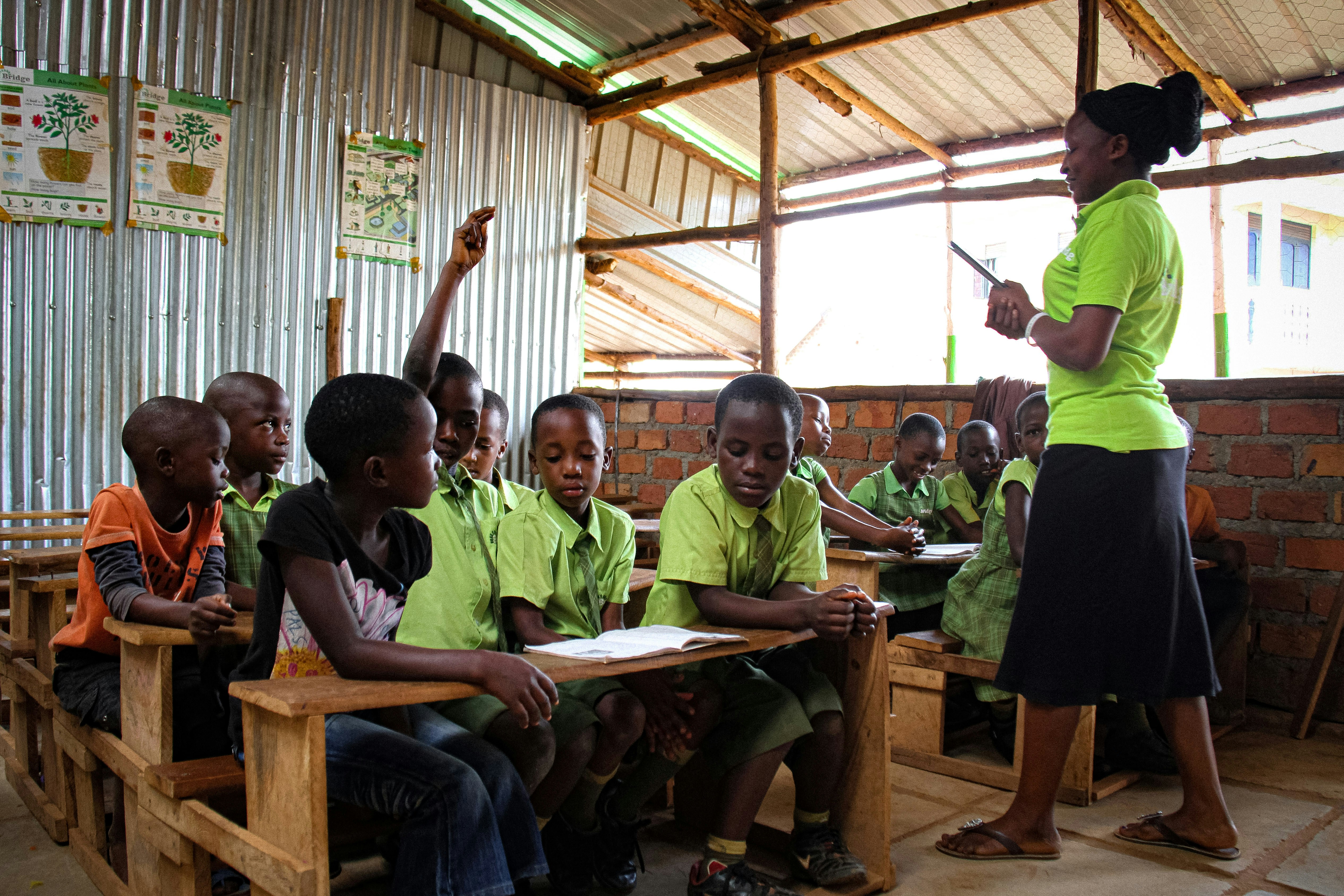 A teacher conducts a class at the Bridge International Academies on November 5, 2016 in Nsumbi, in the suburbs of Kampala. Uganda's High Court on November 4 ordered the closure of a chain of low-cost private schools backed by Microsoft and Facebook founders Bill Gates and Mark Zuckerberg. Judge Patricia Basaza Wasswa ruled the 63 Bridge International Academies provided unsanitary learning conditions, used unqualified teachers and were not properly licensed.  / AFP / GAEL GRILHOT        (Photo credit should read GAEL GRILHOT/AFP via Getty Images)