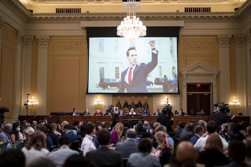 WASHINGTON, DC - JULY 21: A photograph of Sen. Josh Hawley (R-MO) from January 6 is seen on screen hearing of the House Select Committee to Investigate the January 6th Attack on the United States Capitol in the Cannon House Office Building on Thursday, July 21, 2022 in Washington, DC. The bipartisan Select Committee to Investigate the January 6th Attack On the United States Capitol has spent nearly a year conducting more than 1,000 interviews, reviewed more than 140,000 documents day of the attack. (Kent Nishimura / Los Angeles Times via Getty Images)
